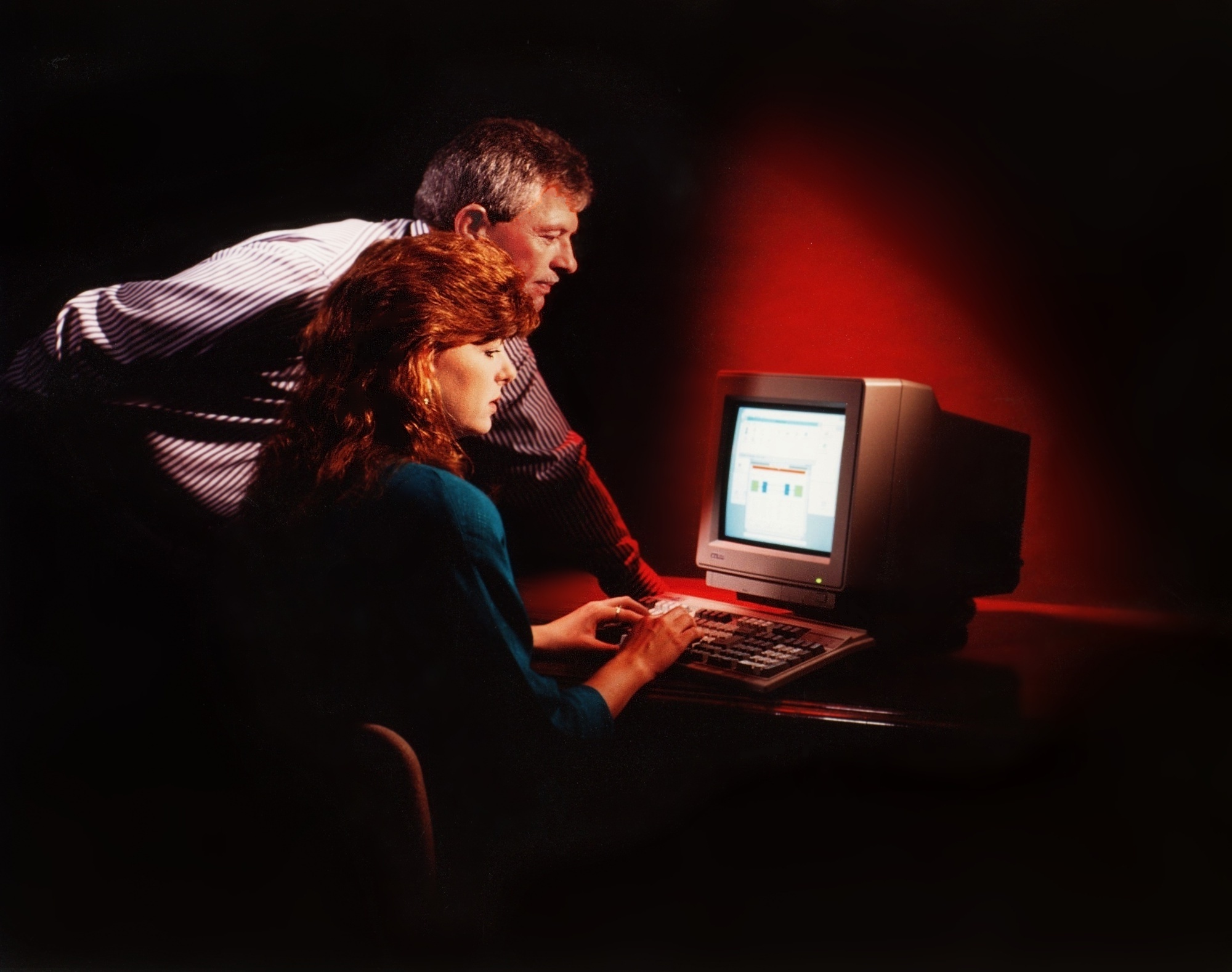 People looking at a computer screen