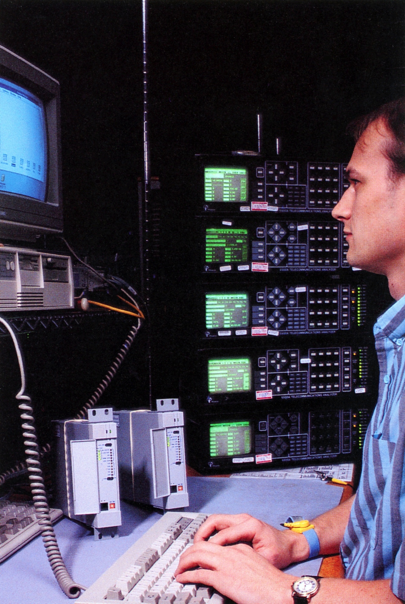Technician tests newly manufactured telecom product